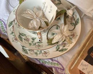 Cups, saucers plates, napkin, rings, and embroidery pillowcases. Just wait till you see these things.