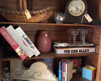 Games and clocks and wine glasses and all kinds of fun things and another country bumpkin cabinet