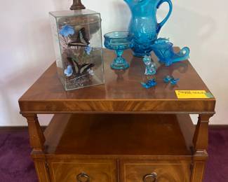 Blue glass, butterflies,
And Midcentury furniture