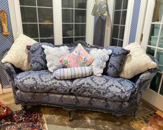 Antique c. 1920 French, carved, over stuffed sofa with cushions.