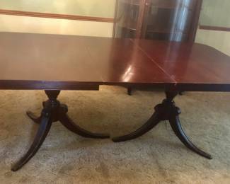 PRE-SALE NOW 1940’s-1950’s Mahogany Duncan Phyfe Rectangle Dining Table is 79.5 inches long (with one leaf that is 18 inches) by 42 inches wide and 29 inches tall. Table has twin 3 legged pedestal bases with traditional brass cap feet. Includes 6 matching chairs. The chairs are in very good condition with Famous Barr Labels. The table has a few scratches but it’s in good condition and has pads. Separate the 6 Chairs are $175 or Just the Table is $175, OR the Table & Chairs Together as a Set Only $300.