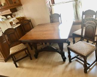 PRE-SALE NOW Bernhardt Furniture Company Table and 6 Chairs. Impressive, Intricate Carved Dining Set from quality Bernhardt Furniture Company, Jacobean / Revival Style Set includes a Square Table with Great Details, Beautiful Natural Stained Wood in Excellent Condition. Entire Set has the original finish, shows very little wear-and-tear (Very Well Taken Care Of). Table measures 50” Wide x 45” Long x 30” Tall.  6 Chairs fabric cushion covered in a neutral fabric. 1 Captain Chair has beautifully carved arms. Table & 6 Chairs $650                                                                ***Unbelievable Bundle Price for Entire Bernhardt Furniture Company, Jacobean / Revival Style Set Includes Table, 6 Chairs, Cupboard, Sideboard $1,500