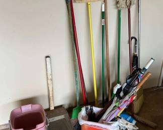 KAS055- Variety of More Brooms, Mops, And Umbrellas