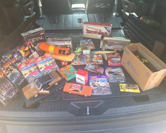Assorted collectible cars and figurines. (opened and played with Hot Wheels, Johnny Lightning Show Stoppers replica car Hemi Under Glass, Johnny Lightning Show Stoppers replica car Dodge Rebellion, General Lee, Gumby and Pokey, 1970 Mercury Cougar Hallmark Keepsake ornament - mfg date 2015,  1969 Dodge Charger, Johnny Lightning Kiss collector set, Johnny Lightning Muscle Cars USA with collector coin, Corvette Metal Die Cast model car, Plymouth Superbird model car kit, Oscar Mayer Weinermobile coin bank with whistle, Gobots and Transformers - used and in packaging, Vintage Corgi Aerial Ladder Fire Truck, Metal Trans  World Airlines plane, Louisville Slugger Kenworth   Semi)