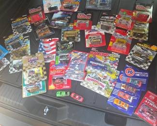 Racing collectible cars and figurines (Dodge - Casey Atwood, Union 76 Official Fuel Nascar series - #24,  #94, #10, #4, Cartoon Network Wacky Racing, Maxwell  Hours Racing car and semi, Country Time Racing car and semi, California Speedway Hot Wheels Racing #00 car - Napa Auto Parts 500 California Speedway - April 30 2000, Revell #3 Dale Earnhardt Goodwrench Monte Carlo, 50th Anniversary Nascar commerative series,  Racing Champions series)
