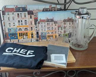 Lot #24 - Chef's Kitchen Essentials Lot - Apron, Cutting Board, Charcuterie Board, Mid Century Gilley Chill-It Pitcher, & Trays