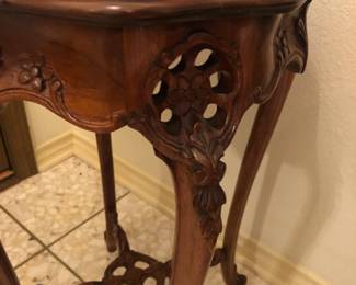 Detail of carved wood side table.