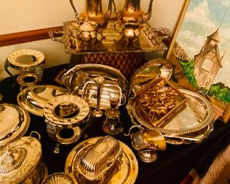 Several silver plated serving pieces