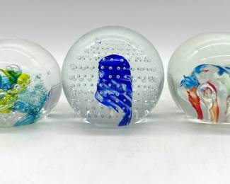 Trio of art glass paperweights
