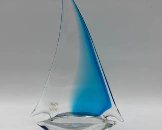 Very nice art glass sail boat has blue to clear sail with clear hull. It is labeled Oggetti Italy