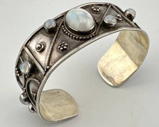 Large sterling silver moonstone cuff is marked India/925; 3"Diam