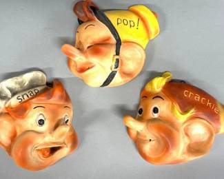 Vintage chalkware string holders in images of "Snap", "Crackle", and "Pop" and marked Kellogg Co.
