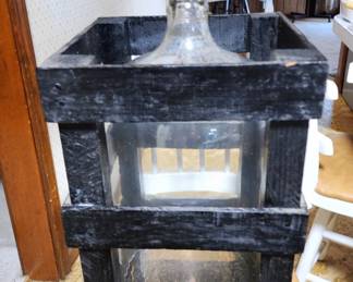 Large bottle for wine making in wooden crate