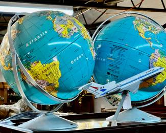 Vintage globes, vintage United Airlines DC 10 model jet
