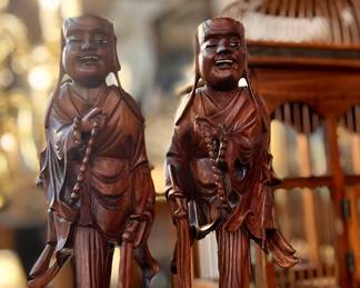 Pair of vintage carved wood, Chinese priests with bone teeth and eyes