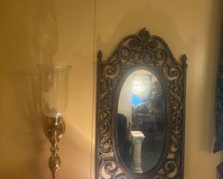 Brass sconce and mirror