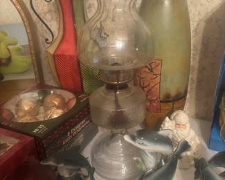 Large hurricane lamp, vase and dolphin decor