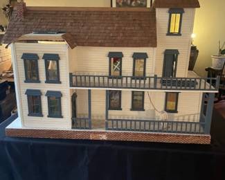 Large 10 room Doll House. Needs repairs (glue, new carpets in rooms, reattach light strings, misc). Frame and support is good.