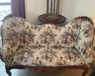 Settee, small table, candle holder