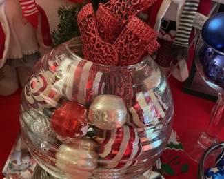 Christmas Ornament Arrangement - Bowl w/ red & white ornaments and red stocking ornaments in a large glass bowl. Sold as a unit only.