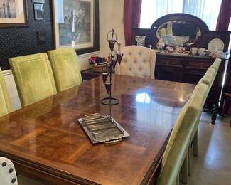 Look at this dining table set. Table has 3 leaves. The Lime green chairs are a great color, however, has many spots on them. Good cleaning will probably remove the stains. End chairs are white.