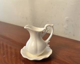 vintage ceramic pitcher and saucer