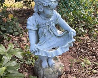 vintage girl with flower basket statue