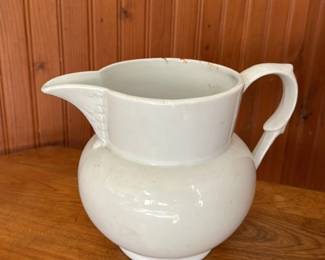 white enameled pitcher
