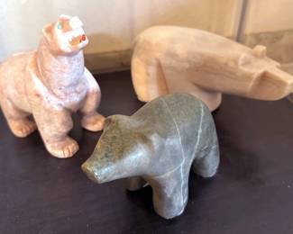 Multiple carved bears of natural materials