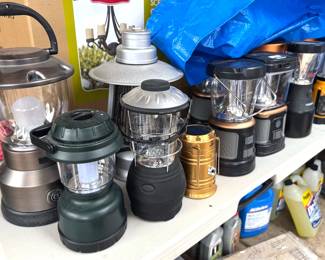Camping equipment: tents, tarps, sleeping bags, bedrolls, chairs, propane, LED lanterns