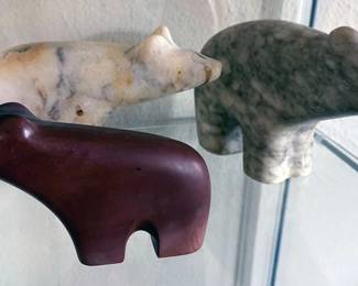 Multiple carved bears of natural materials