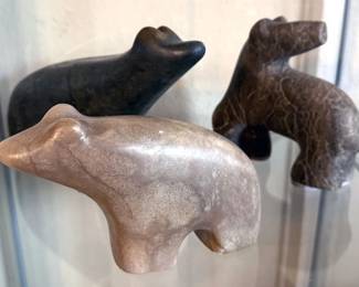 Multiple carved bears of natural materials