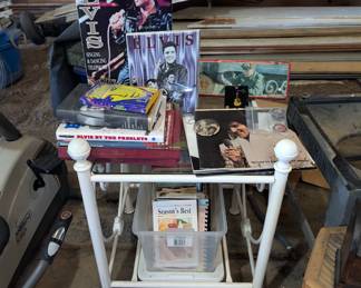 Elvis collectables, cookbooks and small glass top table