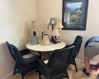 Crate & Barrell, travertine table with 4 wicker chairs. This can be a patio table & chairs but this has never been used as patio furniture.