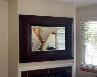 Mirror over the fireplace.