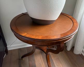 Leon round end table with textured leather surface