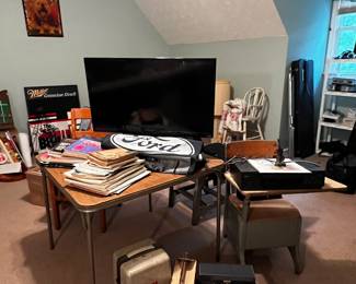 Vintage projector, cameras, school desk, tv, music books 