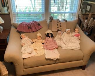 LOVESEAT WITH COLLECTION OF ANTIQUE DOLLS