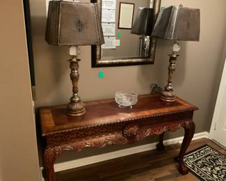 Highly carved table and lamps