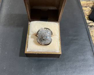 PRINCESS RING WITH RING GUARD. SOLITAIRE DIAMOND IS 1 CARAT WITH TOTAL WEIGHT IN DIAMONDS OF 4 CARATS