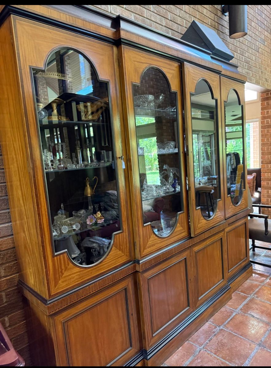 This absolute gorgeous lit cabinet
Has four glass doors and four lower solid doors with plenty of storage for your needs