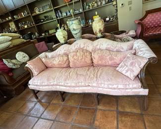 We have a pair of these baby pink downfilled vintage / antique sofas