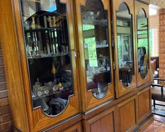 This absolute gorgeous lit cabinet
Has four glass doors and four lower solid doors with plenty of storage for your needs