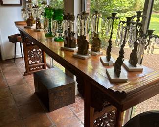 Look at how fabulous these candelabras are sitting on top of this carved table ….