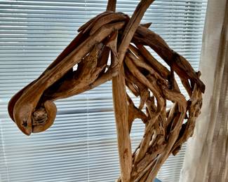 Driftwood sculpture of a horse     60"h x 35"w
