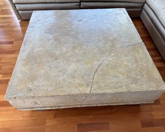 Post modern plaster coffee table with faux crack                    16"h x 49" square