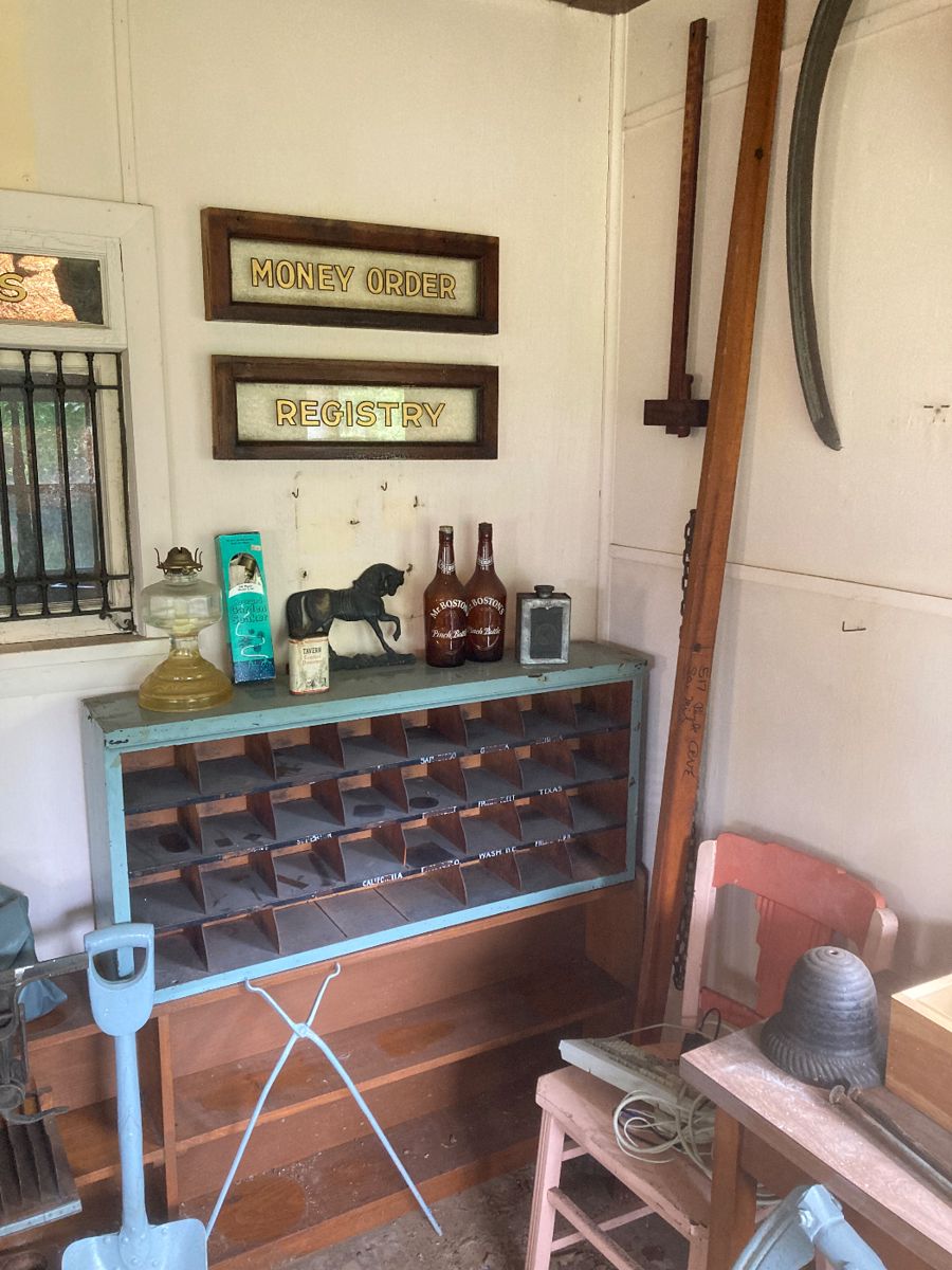 Postal sorting cabinet and reverse painted signage from the Post Office