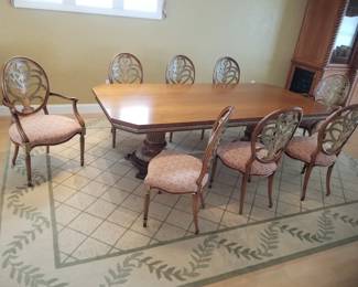 Handsome pedestal dining table seats 8; large rug