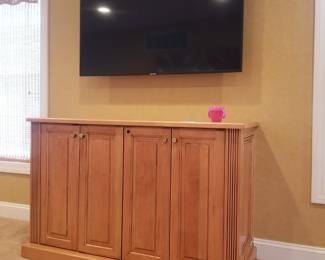 Flat screen TV with wall mount; entertainment console