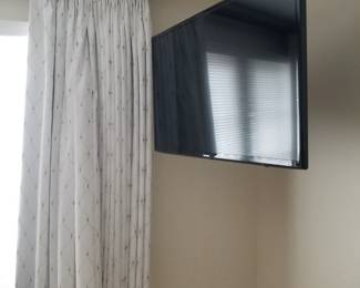 Flat screen TV with mounting bracket